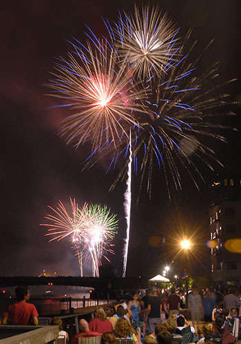 Nighttime fireworks by Spectrum Pyrotechnics Beautiful Fireworks Display at Night on Rooftop Provided by Spectrum Pyrotechnics